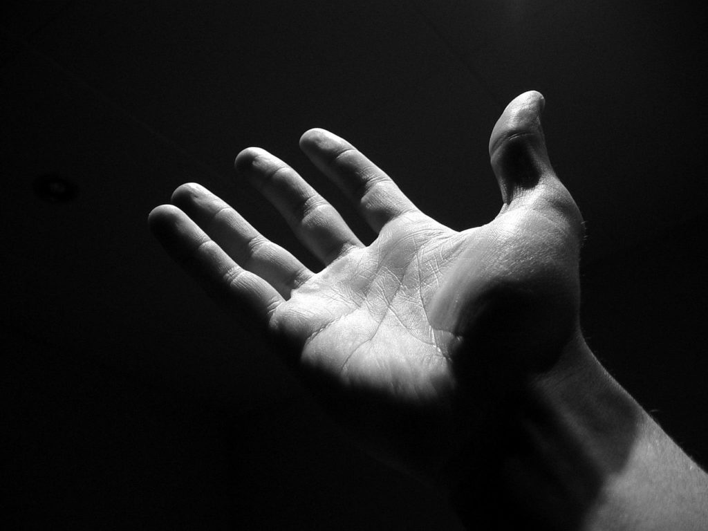 This image of a mans hand reaching upward with an open palm through darkness represents the solitude of men's issues and the isolation even in community they face, being taught to not share feelings and to always be ok and provide. The open palm represents a desire for connection and also an offer of support, encompassing all aspects of men;s mental health in an inclusive and affirming guesture.

Image for Inclusive and Affirming Men’s Issues: a hand, black, dark, men, monochrome, hand, hand, hand, hand, hand, men, men
