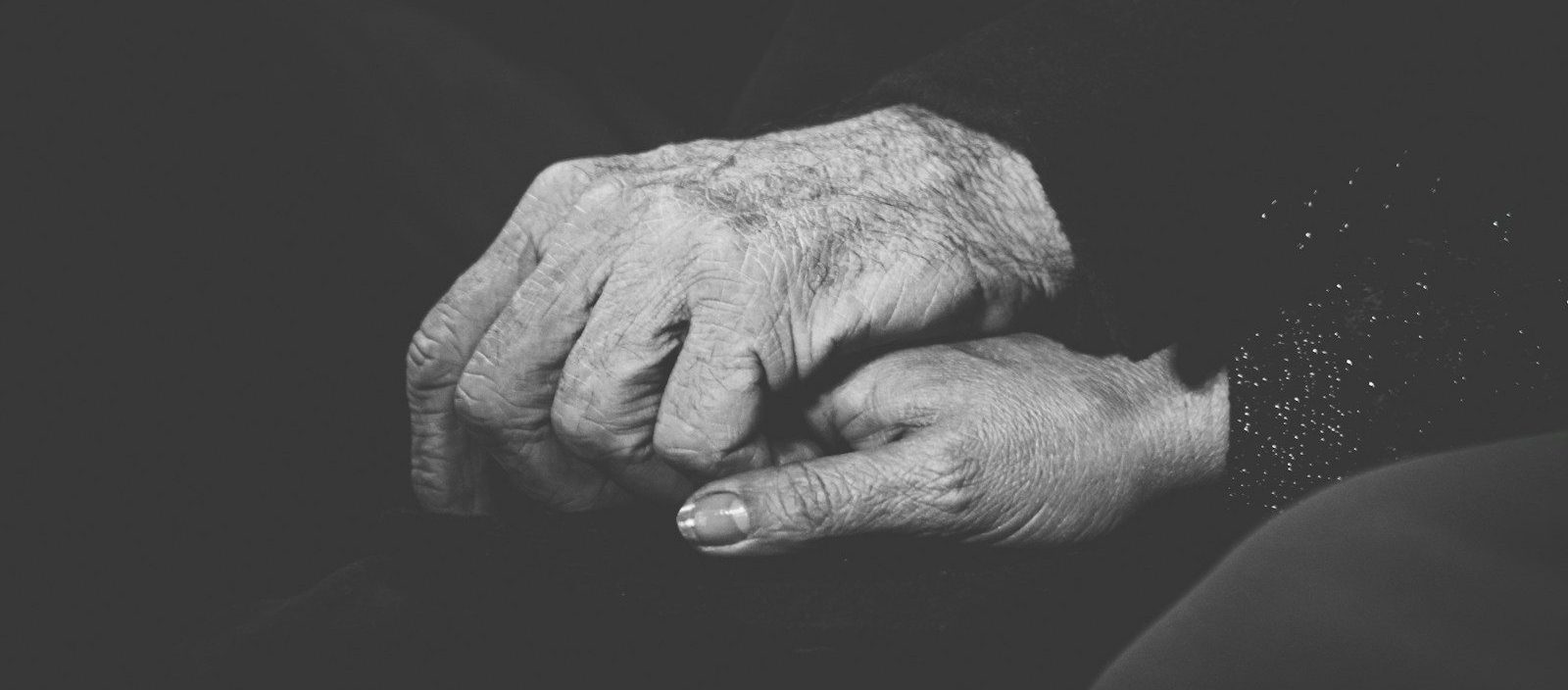 grayscale photo of persons hand